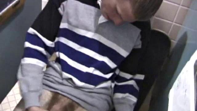 We catch up with Christian on an outdoor stairway. He leads us to a men's room with glory holes. Tere, Christian jacks off to photos in a straight porn magazine.