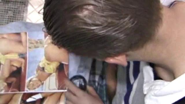 We catch up with Christian on an outdoor stairway. He leads us to a men's room with glory holes. Tere, Christian jacks off to photos in a straight porn magazine.