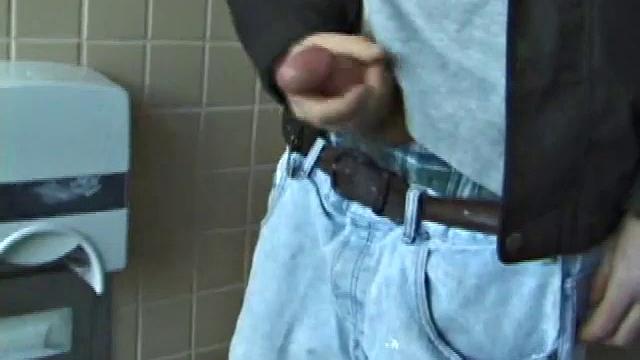 We catch up with Christian on an outdoor stairway. He leads us to a men's room with glory holes. Tere, Christian jacks off to photos in a straight porn magazine.