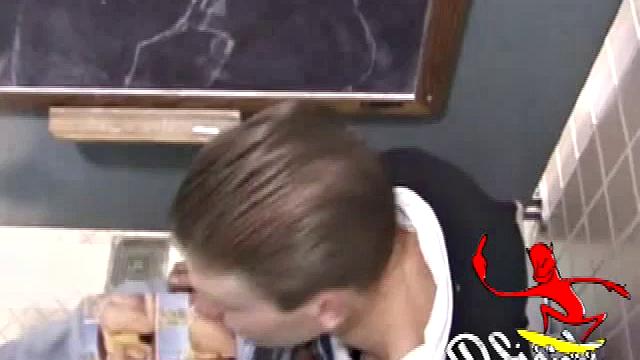 We catch up with Christian on an outdoor stairway. He leads us to a men's room with glory holes. Tere, Christian jacks off to photos in a straight porn magazine.