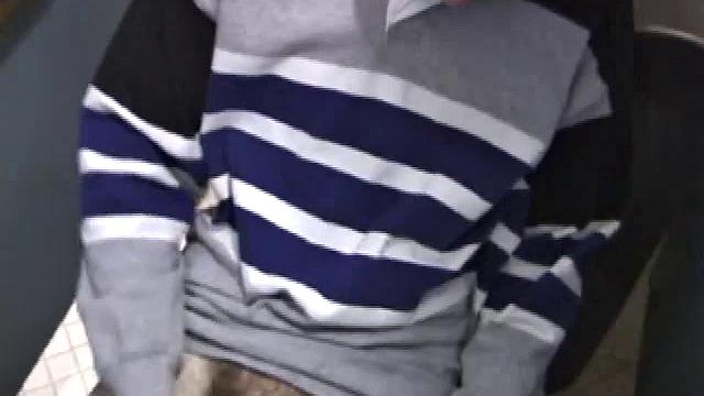 We catch up with Christian on an outdoor stairway. He leads us to a men's room with glory holes. Tere, Christian jacks off to photos in a straight porn magazine.