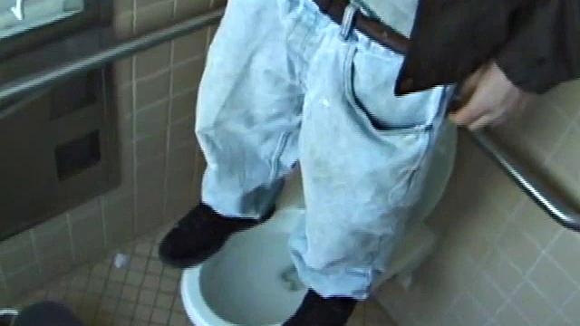 We catch up with Christian on an outdoor stairway. He leads us to a men's room with glory holes. Tere, Christian jacks off to photos in a straight porn magazine.