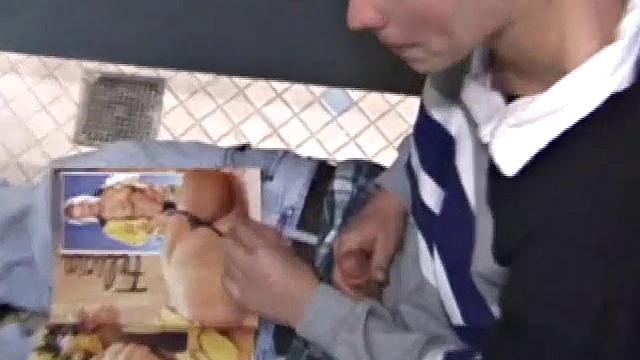 We catch up with Christian on an outdoor stairway. He leads us to a men's room with glory holes. Tere, Christian jacks off to photos in a straight porn magazine.