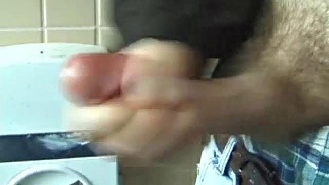 We catch up with Christian on an outdoor stairway. He leads us to a men's room with glory holes. Tere, Christian jacks off to photos in a straight porn magazine.