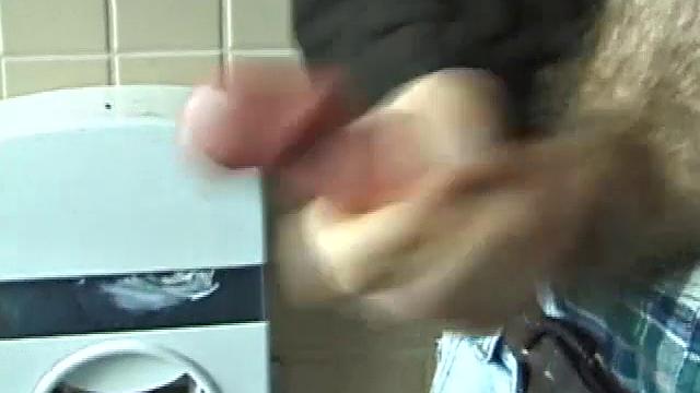 We catch up with Christian on an outdoor stairway. He leads us to a men's room with glory holes. Tere, Christian jacks off to photos in a straight porn magazine.