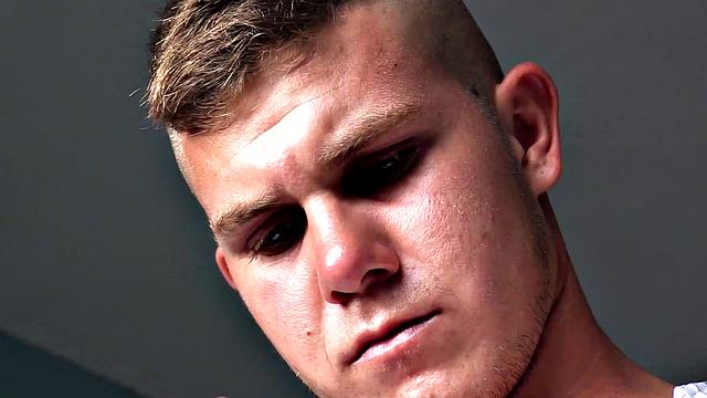 Dyron is a horny young man, who strips naked and works up a stiff one, while watching some porn on his phone. Once he's worked up and ready to go, Dyron kicks back on the bed and starts beating off.