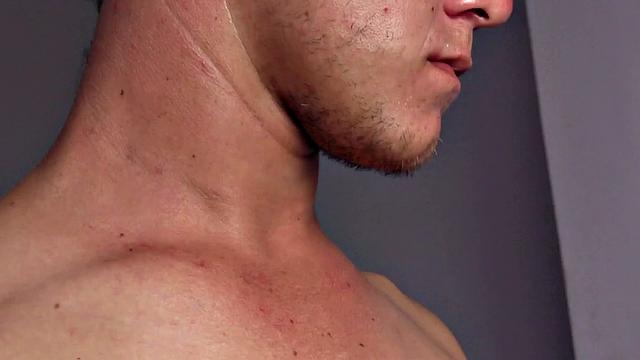 Dyron is a horny young man, who strips naked and works up a stiff one, while watching some porn on his phone. Once he's worked up and ready to go, Dyron kicks back on the bed and starts beating off.