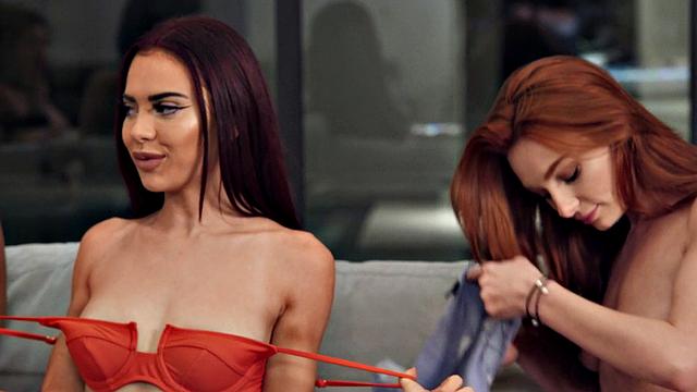 Latina and blonde lesbians explore each other's bodies in hot bedroom action