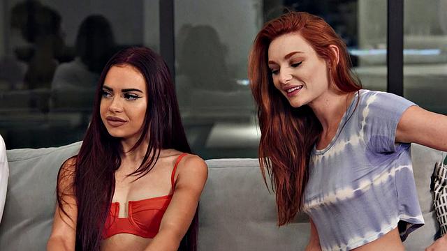 Latina and blonde lesbians explore each other's bodies in hot bedroom action