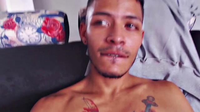 Juan slowly strips out of his T-shirt, as he works on getting himself hard. Once naked, the skinny and inked Latino kicks back and starts stroking his stiff dick.