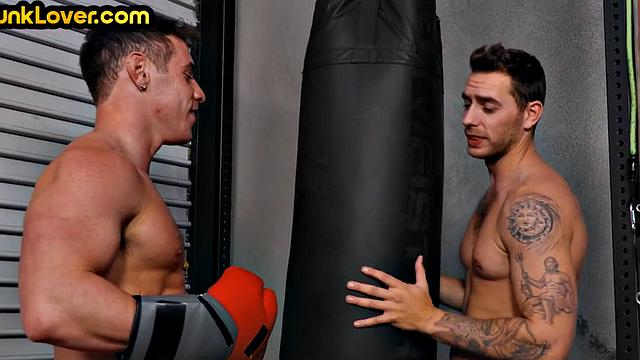 Sportive athletic jock barebacks bottom in gym after boxing