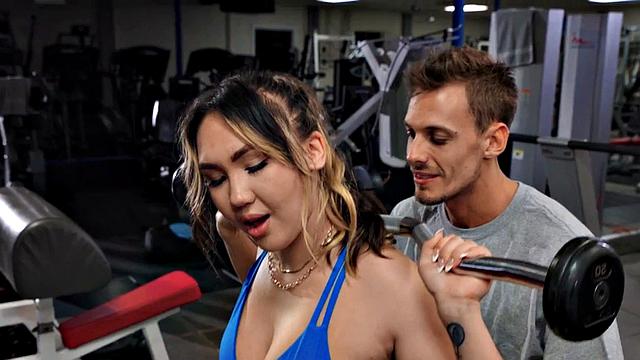 Watch this tattooed gym babe take a massive rod in her wet pussy from behind