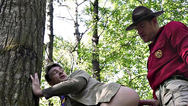 DILF scout fucks twink outdoors while voyeur watches