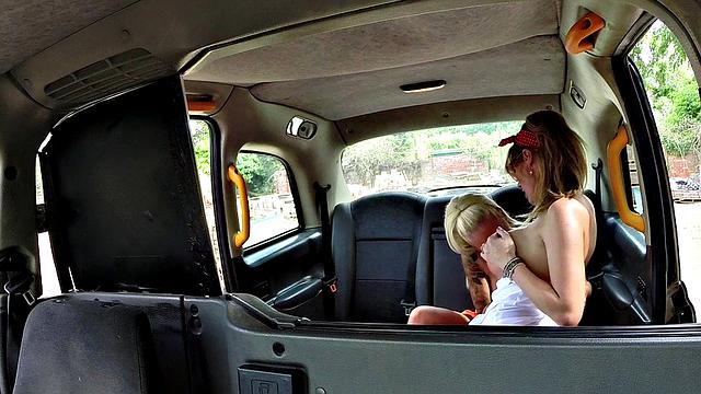 Big-titted tattooed lesbians lick each other's pussies in a cab