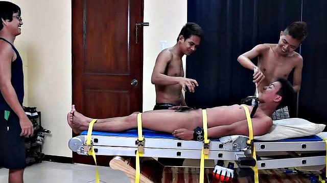 This cute and ticklish Asian twink is strapped down to the tickling rack as Benjamin, Willy, and Ricky take turns putting him through the tickle torment of his life. Each tickler takes his turn driving Warren to hysterics with methods.