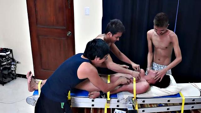 This cute and ticklish Asian twink is strapped down to the tickling rack as Benjamin, Willy, and Ricky take turns putting him through the tickle torment of his life. Each tickler takes his turn driving Warren to hysterics with methods.