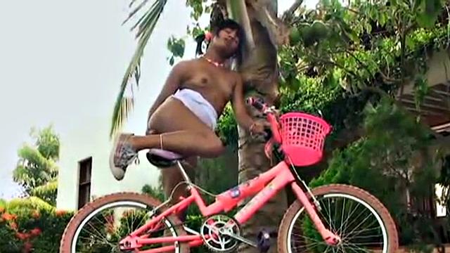 Tobie Teen gets naughty in a garden, stripping off to show her small tits and great ass. She rubs her tits and fingers pussy