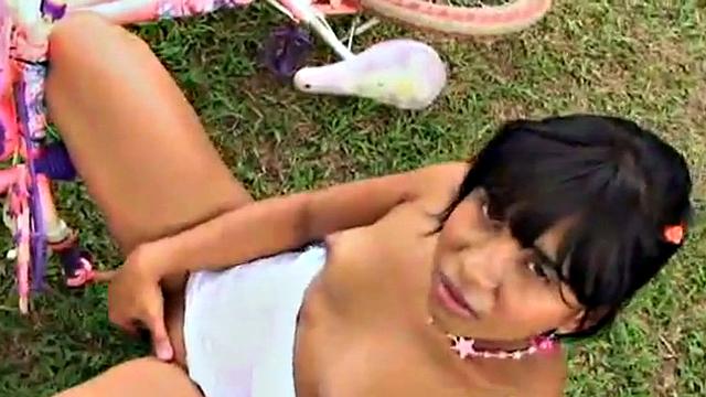 Tobie Teen gets naughty in a garden, stripping off to show her small tits and great ass. She rubs her tits and fingers pussy