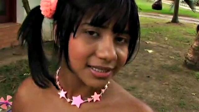 Tobie Teen gets naughty in a garden, stripping off to show her small tits and great ass. She rubs her tits and fingers pussy