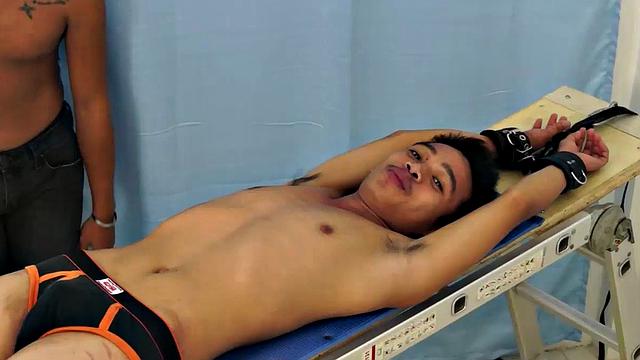 Introducing cute and ticklish Asian twink Jojo. This is his first shoot with Laughing Asians. Our long haired Asian boy Hunter is the sadistic tickler who has strapped Jojo down on the tickle rack and puts gim through his first tickle experience.