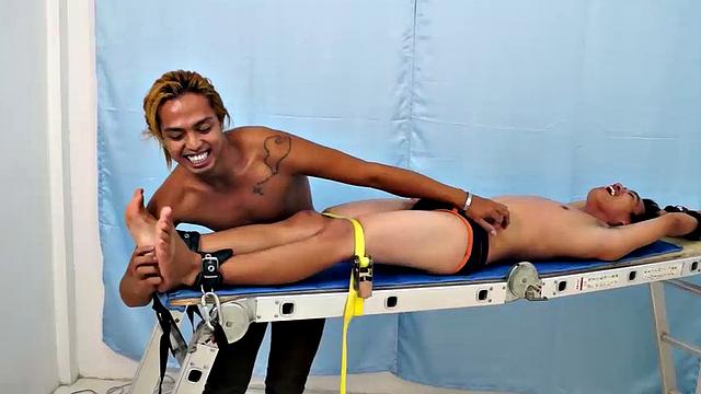 Introducing cute and ticklish Asian twink Jojo. This is his first shoot with Laughing Asians. Our long haired Asian boy Hunter is the sadistic tickler who has strapped Jojo down on the tickle rack and puts gim through his first tickle experience.