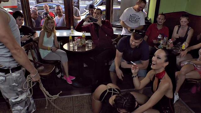 Publicly humiliated sub sucking with voyeurs watching