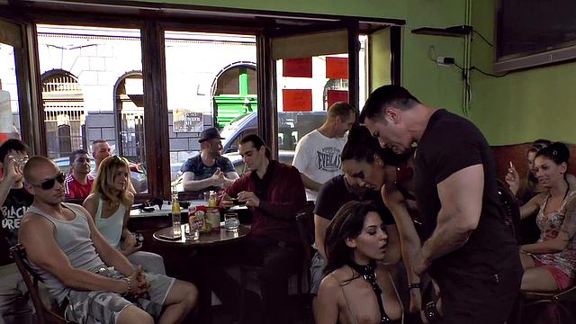 Publicly humiliated sub sucking with voyeurs watching