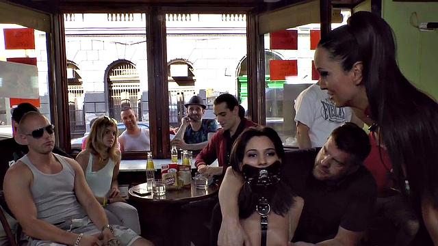 Publicly humiliated sub sucking with voyeurs watching