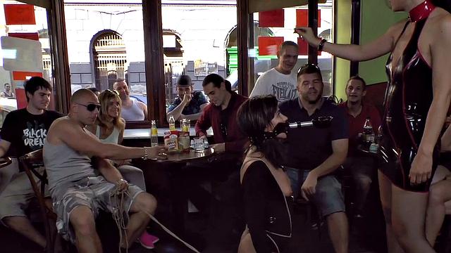 Publicly humiliated sub sucking with voyeurs watching