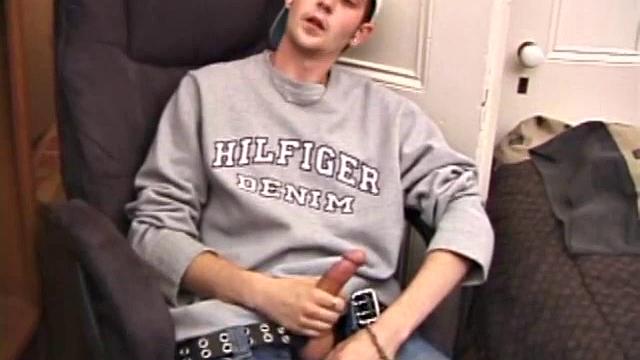 As a porn flick plays, young amateur Aaron Michaels strokes hard, pulls his cock out of his jeans, lets loose, and spills his nut on the bed.