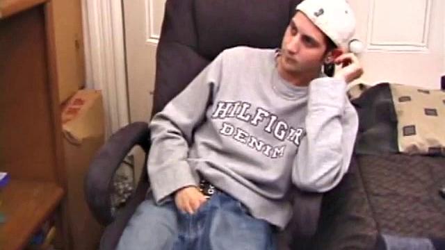 As a porn flick plays, young amateur Aaron Michaels strokes hard, pulls his cock out of his jeans, lets loose, and spills his nut on the bed.