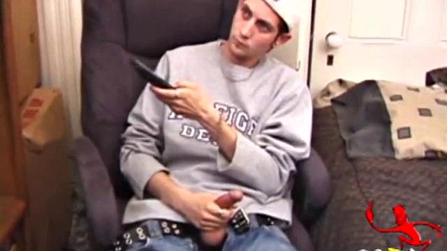 As a porn flick plays, young amateur Aaron Michaels strokes hard, pulls his cock out of his jeans, lets loose, and spills his nut on the bed.