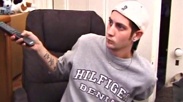 As a porn flick plays, young amateur Aaron Michaels strokes hard, pulls his cock out of his jeans, lets loose, and spills his nut on the bed.