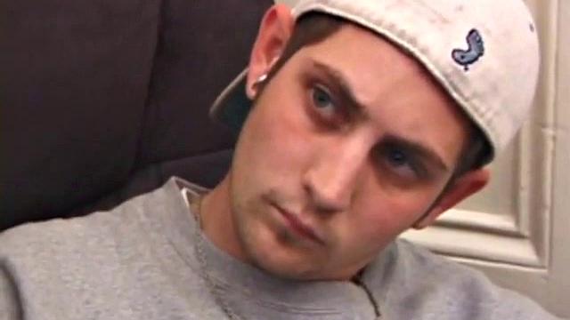 As a porn flick plays, young amateur Aaron Michaels strokes hard, pulls his cock out of his jeans, lets loose, and spills his nut on the bed.