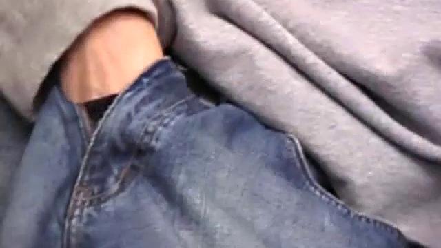 As a porn flick plays, young amateur Aaron Michaels strokes hard, pulls his cock out of his jeans, lets loose, and spills his nut on the bed.