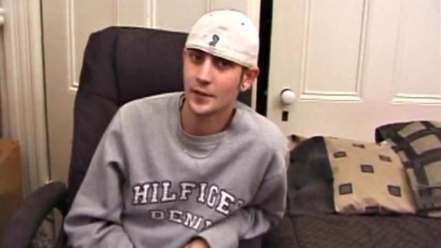 As a porn flick plays, young amateur Aaron Michaels strokes hard, pulls his cock out of his jeans, lets loose, and spills his nut on the bed.