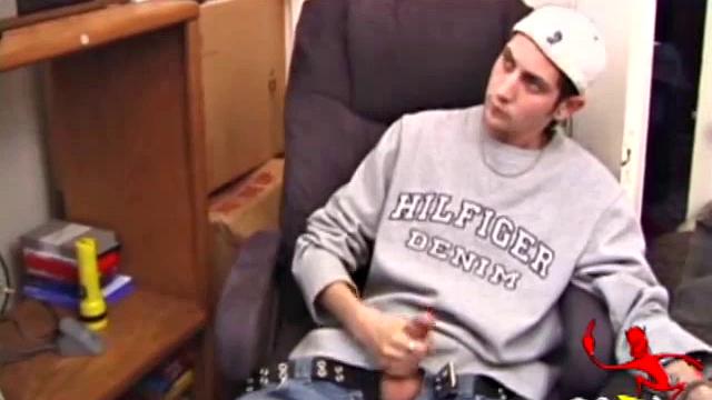 As a porn flick plays, young amateur Aaron Michaels strokes hard, pulls his cock out of his jeans, lets loose, and spills his nut on the bed.