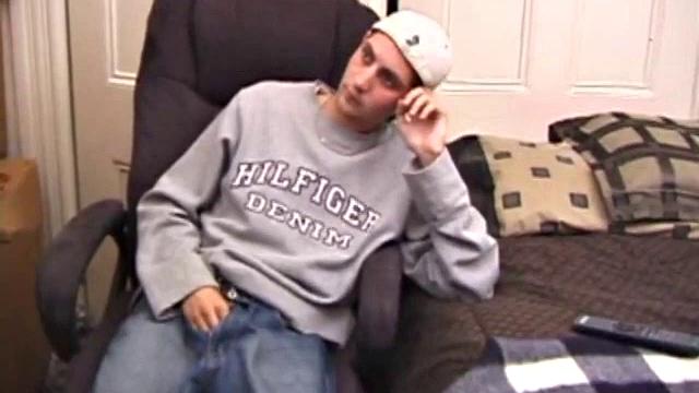 As a porn flick plays, young amateur Aaron Michaels strokes hard, pulls his cock out of his jeans, lets loose, and spills his nut on the bed.