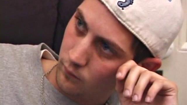 As a porn flick plays, young amateur Aaron Michaels strokes hard, pulls his cock out of his jeans, lets loose, and spills his nut on the bed.