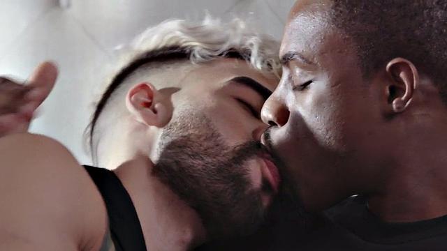 Muscular black dude fucks white guy's ass while kissing passionately