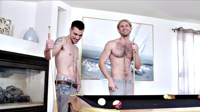 Athletic jock with tattoos takes a cumshot after a game of billiards and ass-licking