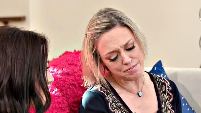 Watch this tattooed MILF devour and lick each other's wet pussies in the living room