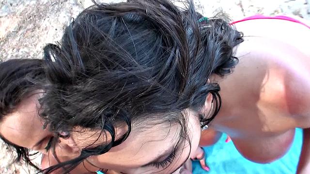 Watch this tattooed brunette bikini babe take a POV deep-throat and peaches on the beach