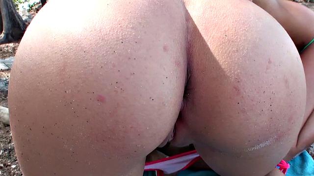 Watch this tattooed brunette bikini babe take a POV deep-throat and peaches on the beach