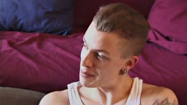 Shane and Brandon are naked and jerking off next to each other while watching a lesbian porn video. Shane spends a lot of time on his knees stroking his cock beside Brandon's slippery dick.