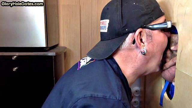 Gloryhole gay enjoys jerking while sucking big dick