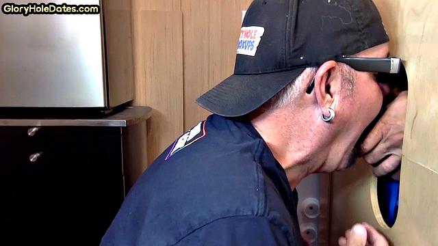 Gloryhole gay enjoys jerking while sucking big dick