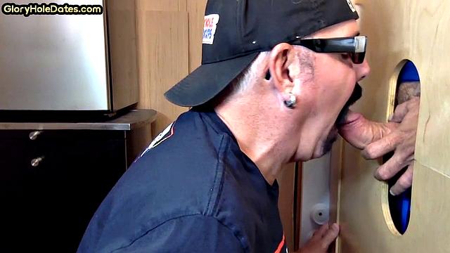 Gloryhole gay enjoys jerking while sucking big dick