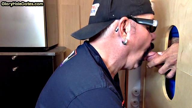 Gloryhole gay enjoys jerking while sucking big dick