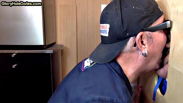 Gloryhole gay enjoys jerking while sucking big dick
